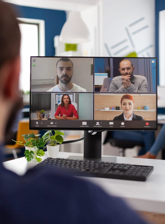 Businessman talking with remote team planning management strategy together during online videocall meeting conference in startup business company office. Teleconference call on computer screen