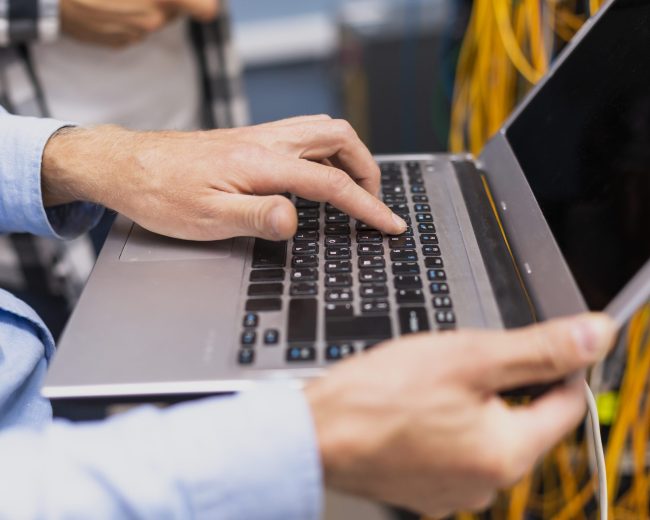 person-typing-laptop-close-up